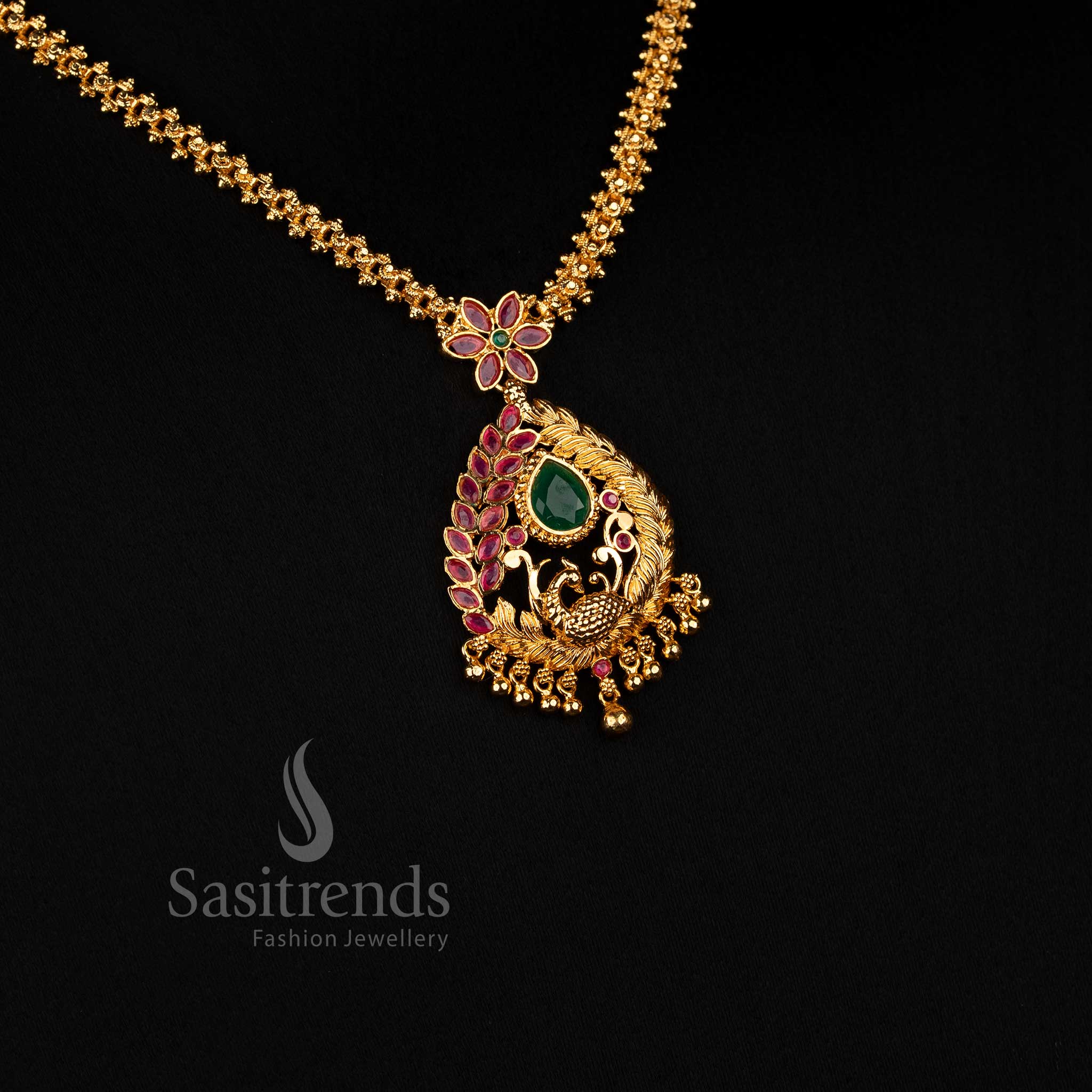 Sasitrends traditional-inspired necklace designed with a detailed teardrop framework, curved botanical motifs and a beaded lower pendant finish 