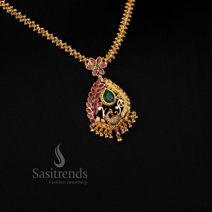 Sasitrends traditional-inspired necklace designed with a detailed teardrop framework, curved botanical motifs and a beaded lower pendant finish 