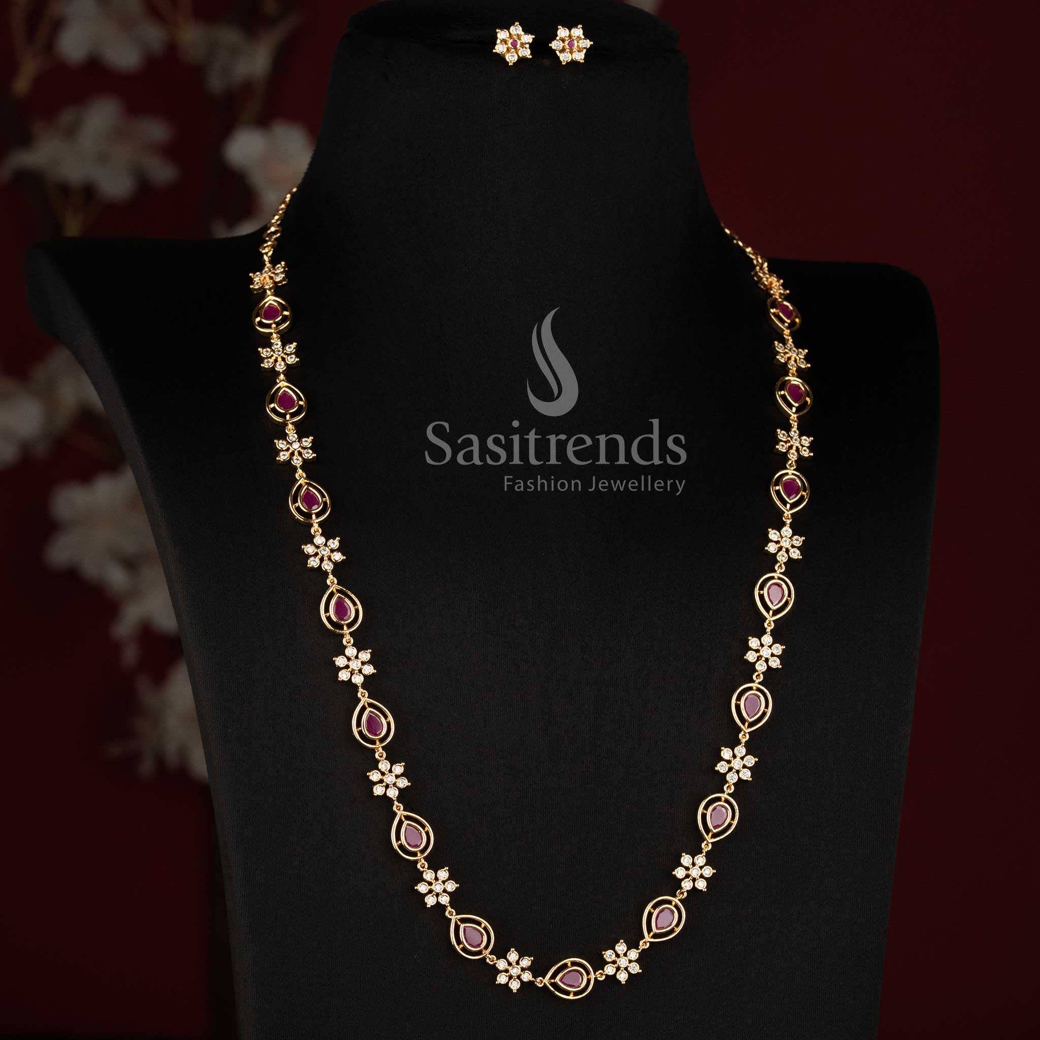 Sasitrends fashionable Impon Addigai jewellery set with a graceful short and long necklace structure and matching floral AD stone earrings 
