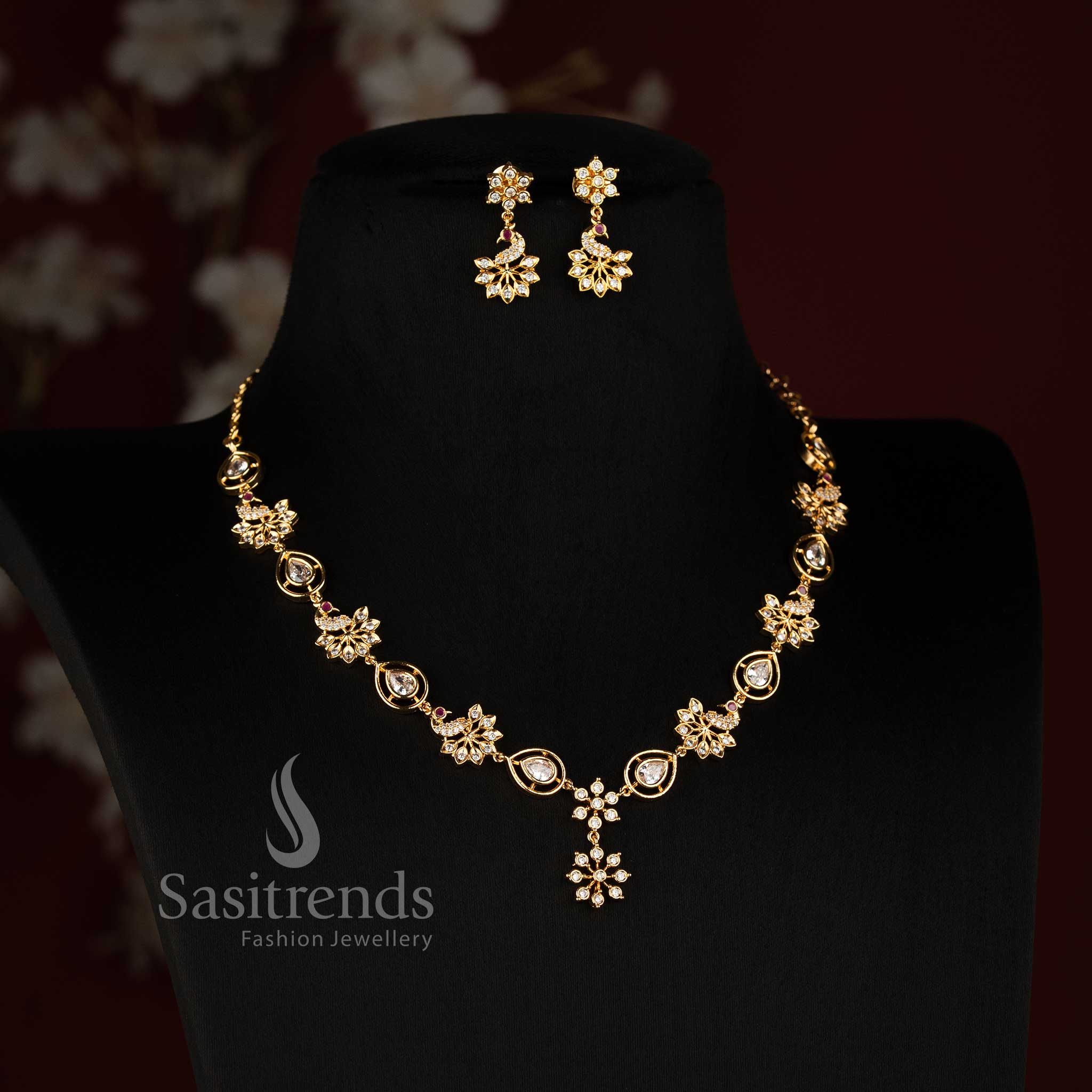 Sasitrends micro gold plated Impon Addigai necklace jewellery set featuring repeated floral motifs, pear-shaped elements and matching earrings 