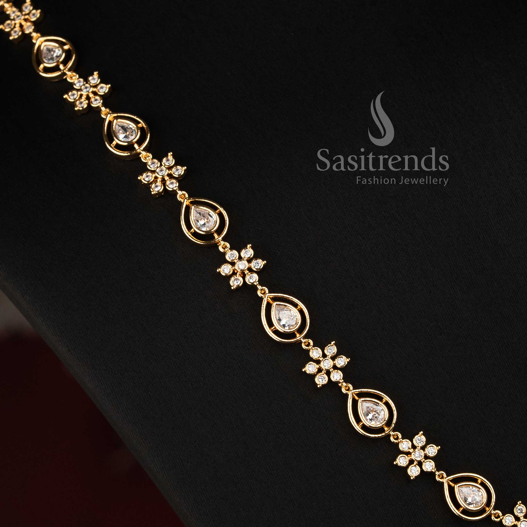 Sasitrends micro gold plated Impon Addigai jewellery set featuring repeated floral arrangements, circular settings and pear-shaped AD stone details 