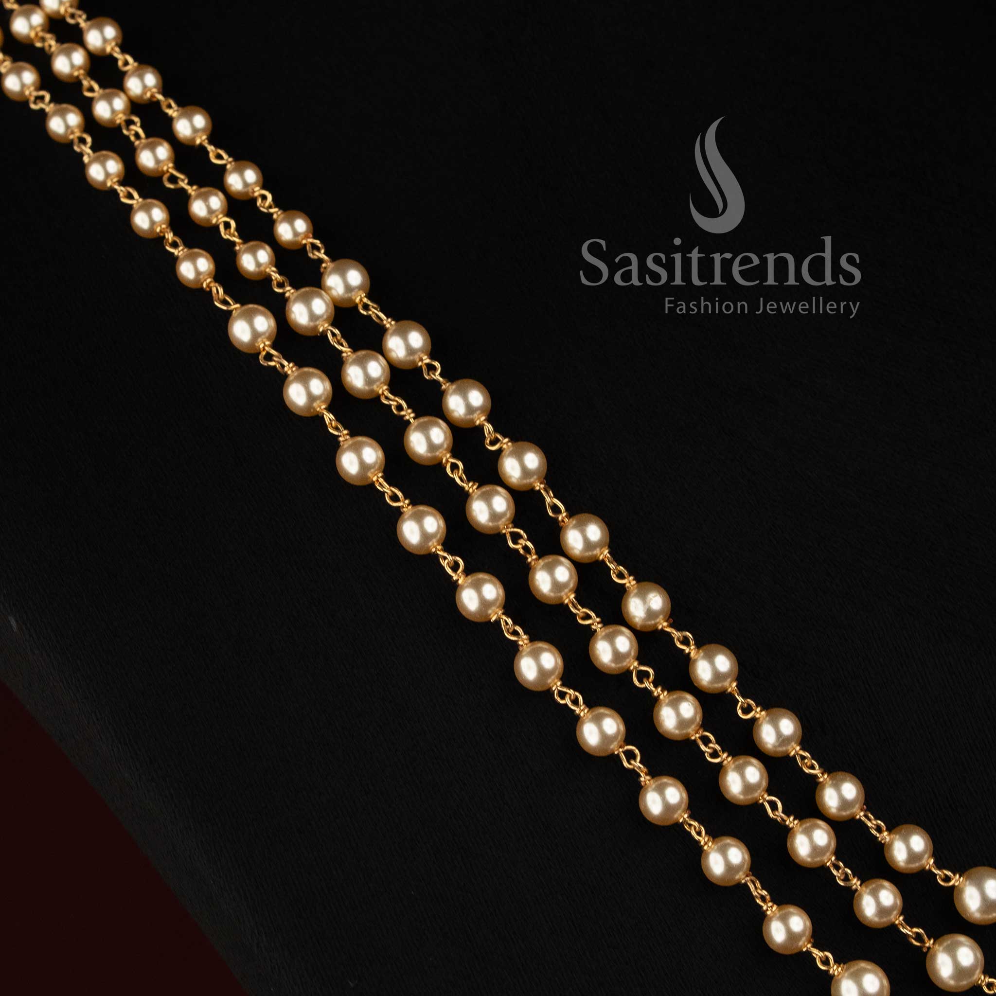 Micro Gold Plated round pearl link chain necklace with three graduated strands and elegant traditional detailing 