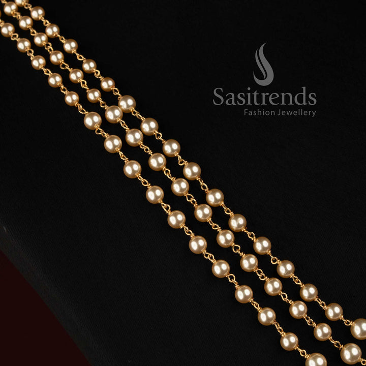 Micro Gold Plated round pearl link chain necklace with three graduated strands and elegant traditional detailing 