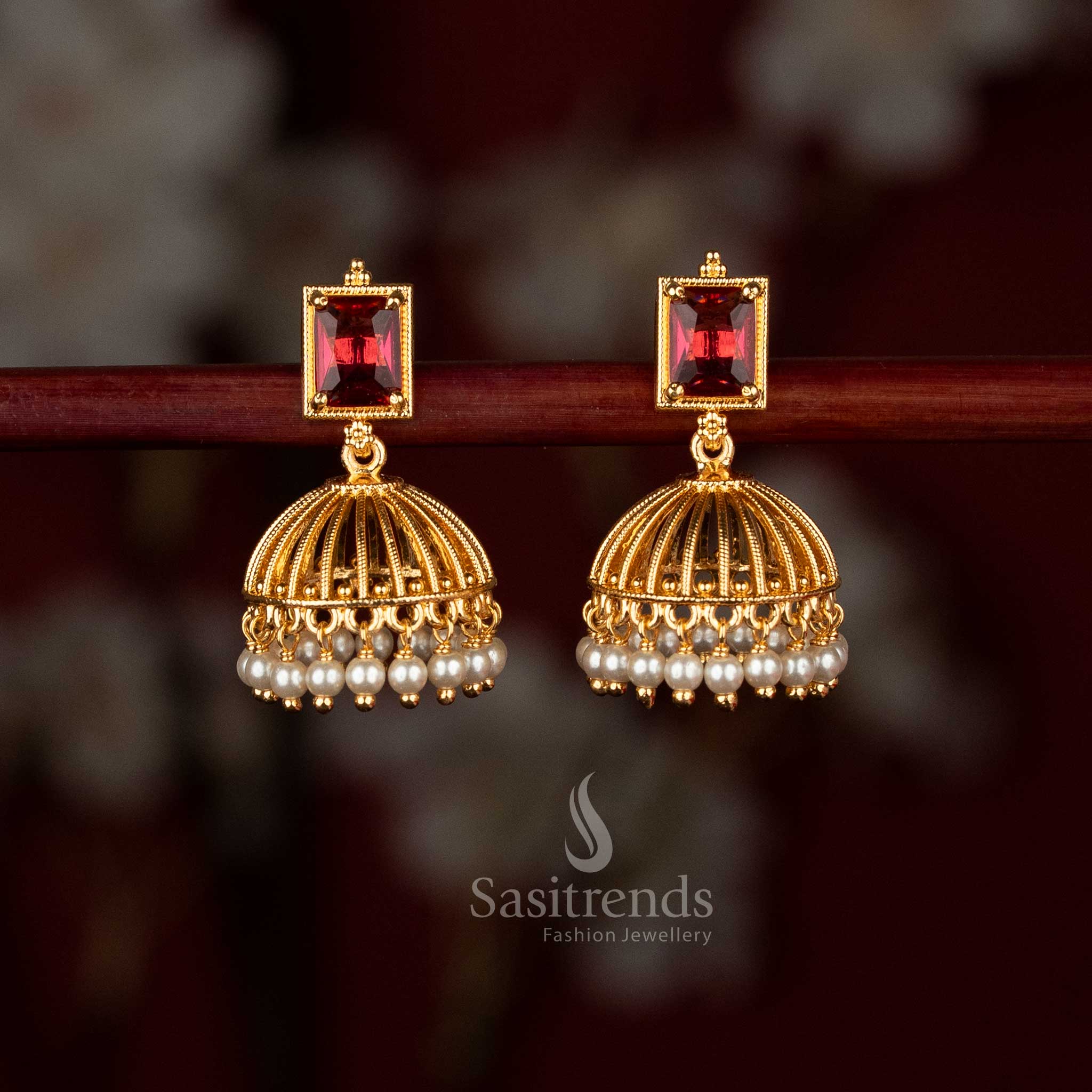 Sasitrends micro gold plated rectangular red AD stone studded pearl hanging jhumka earrings with cage dome design