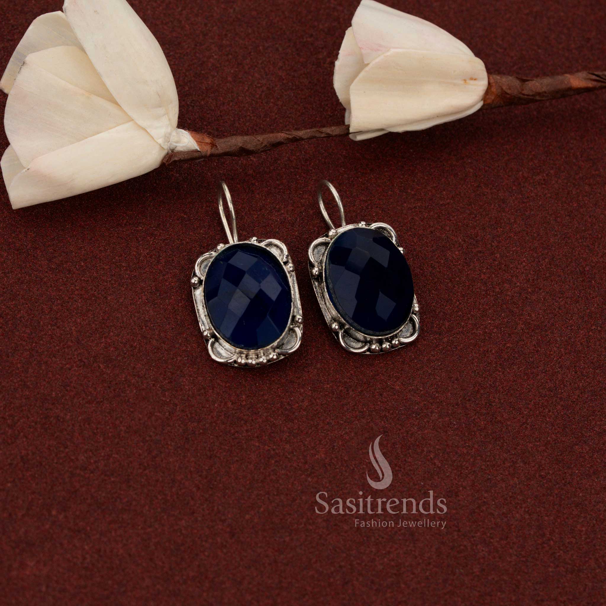 Sasitrends minimal vintage oxidised German silver drop earrings accented with oval faceted blue stone and subtle floral detailing