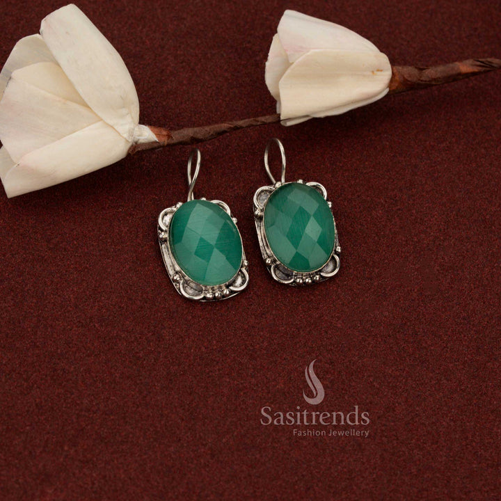 Sasitrends antique style oxidised German silver drop earrings crafted with oval mint stone and floral frame detailing