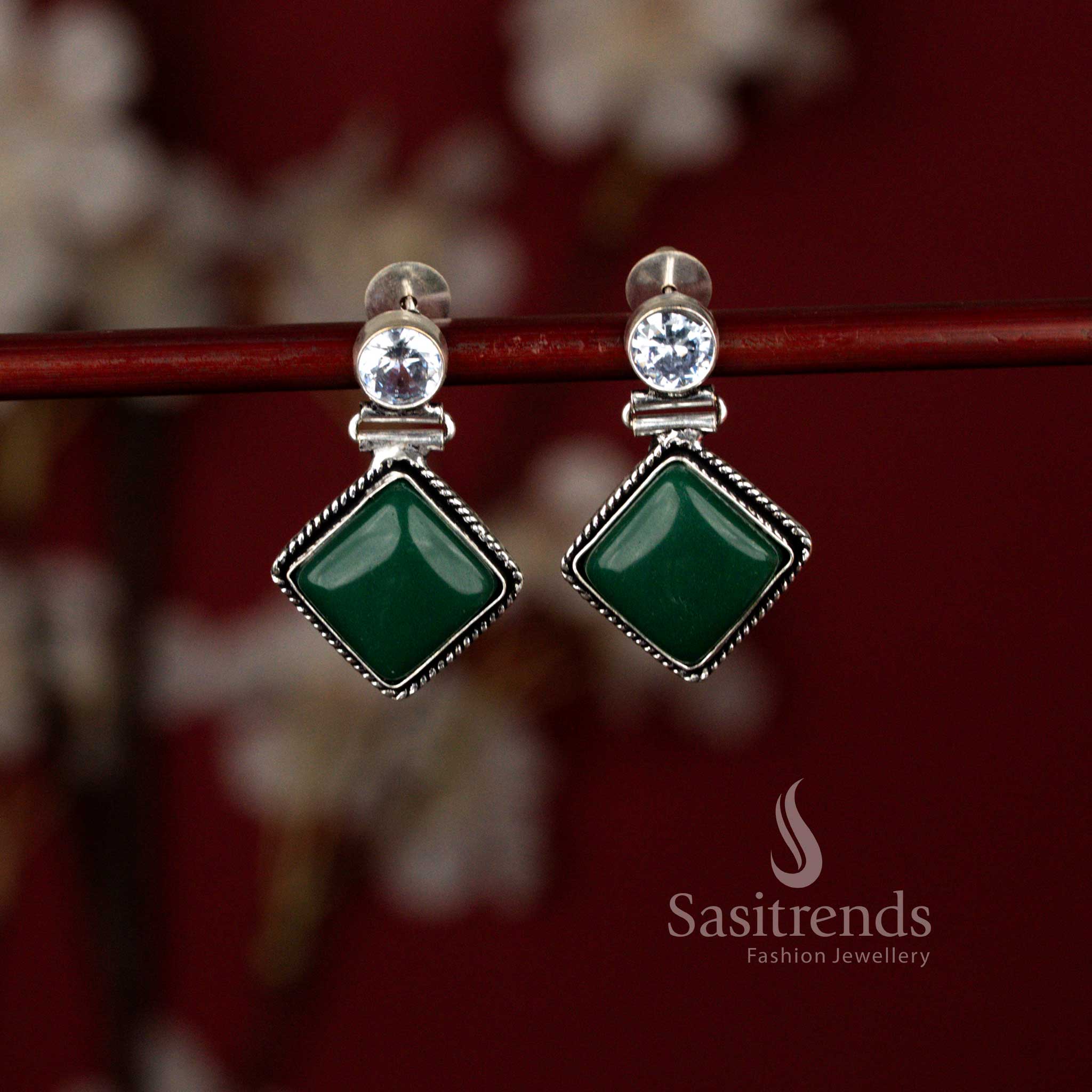 Modern oxidised Monalisa green stone earrings from Sasitrends featuring an eye-shaped center design within a structured rhombus frame, beautifully complementing kurtis, sarees and contemporary office outfits.