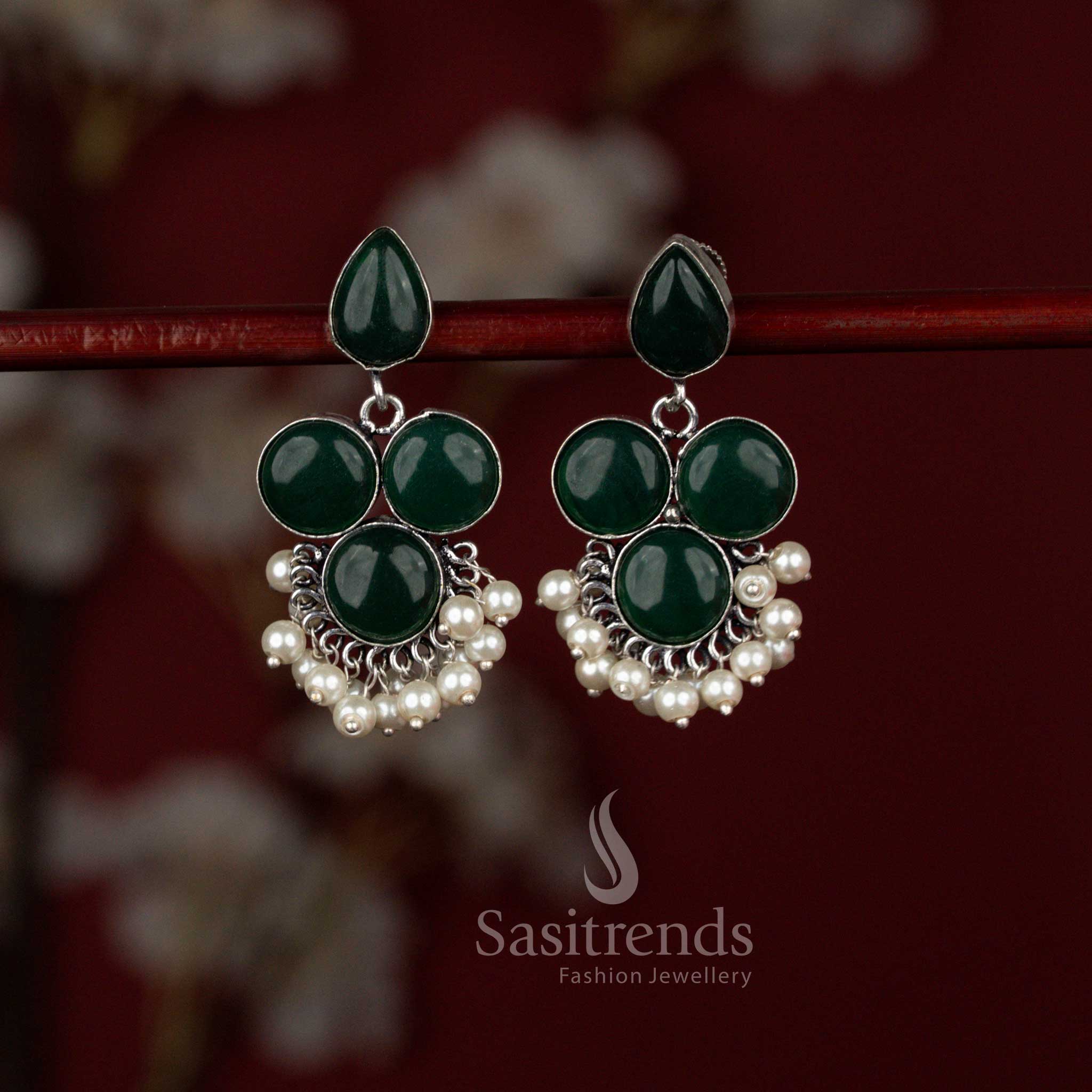 Modern green oxidised silver earrings by Sasitrends crafted with a luminous round Monalisa stone paired with a teardrop element and refined pearl detailing, suitable for office wear and kurti styling.