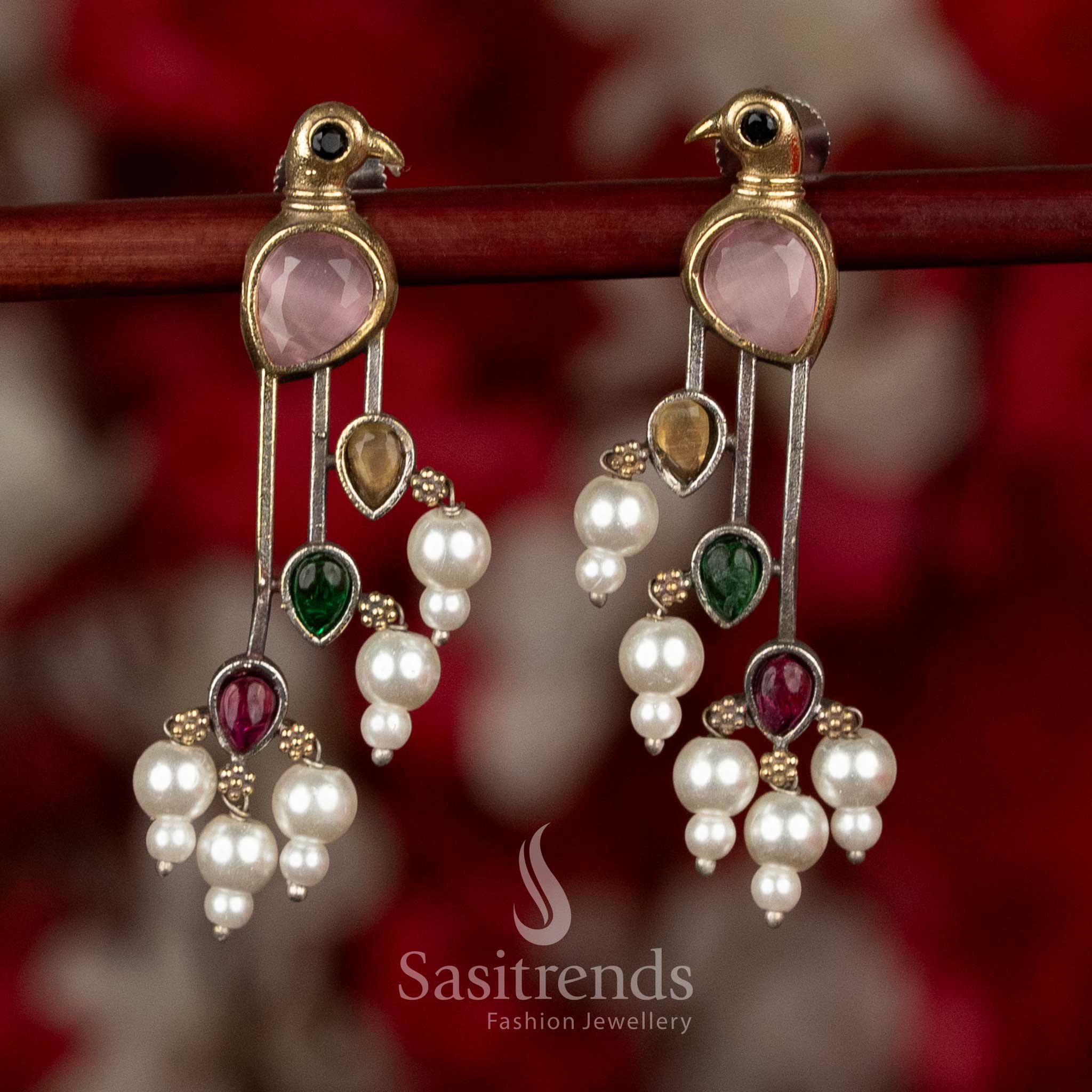 
Sasitrends pink mult icolor oxidised silver parrot earrings crafted with layered stone arrangement and pearl accents for festive and ethnic wear
