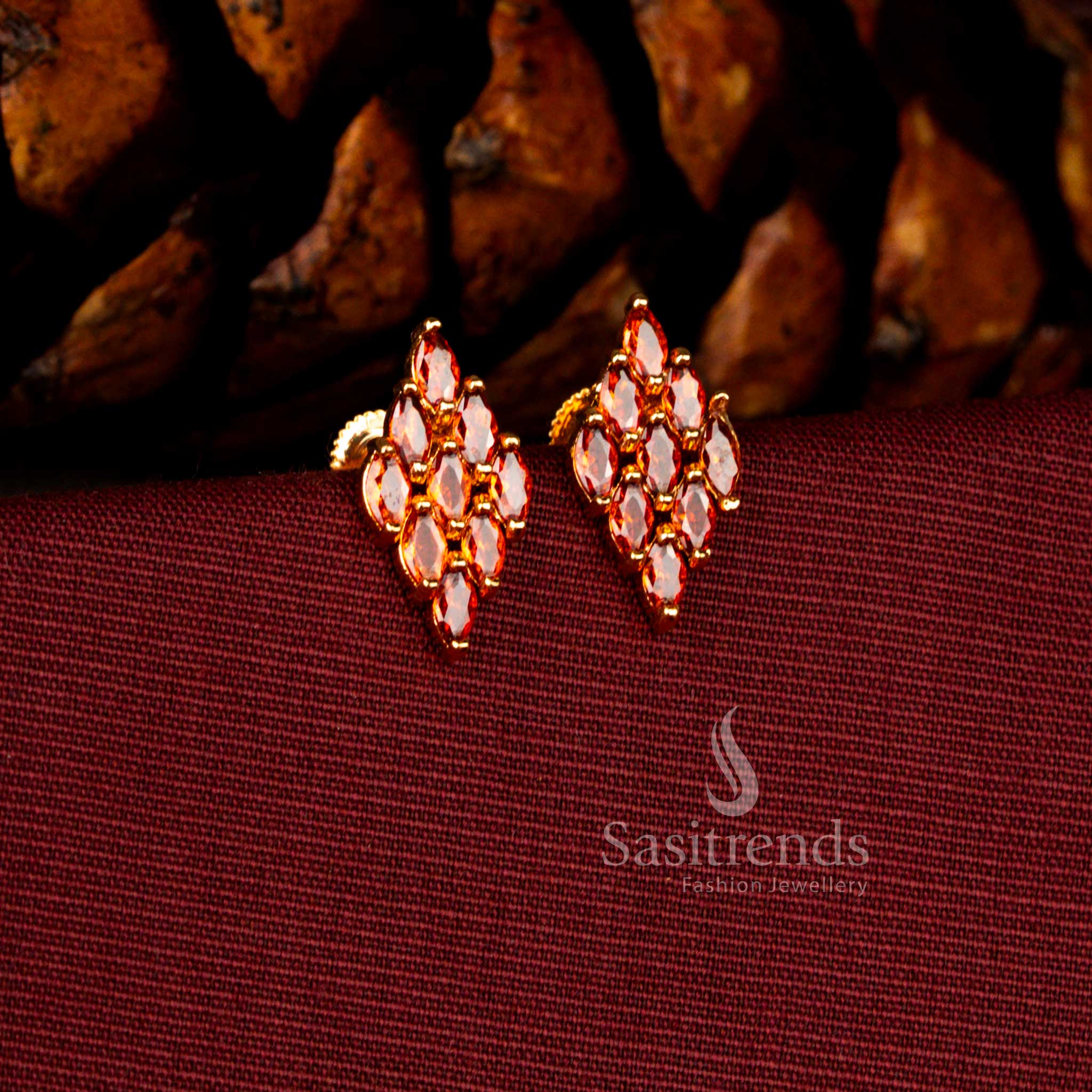 Sasitrends bridal micro gold plated orange AD earrings crafted in a sleek rhombus silhouette with sparkling stone embellishments and a guaranteed 24 carat gold finish ideal for weddings and receptions.