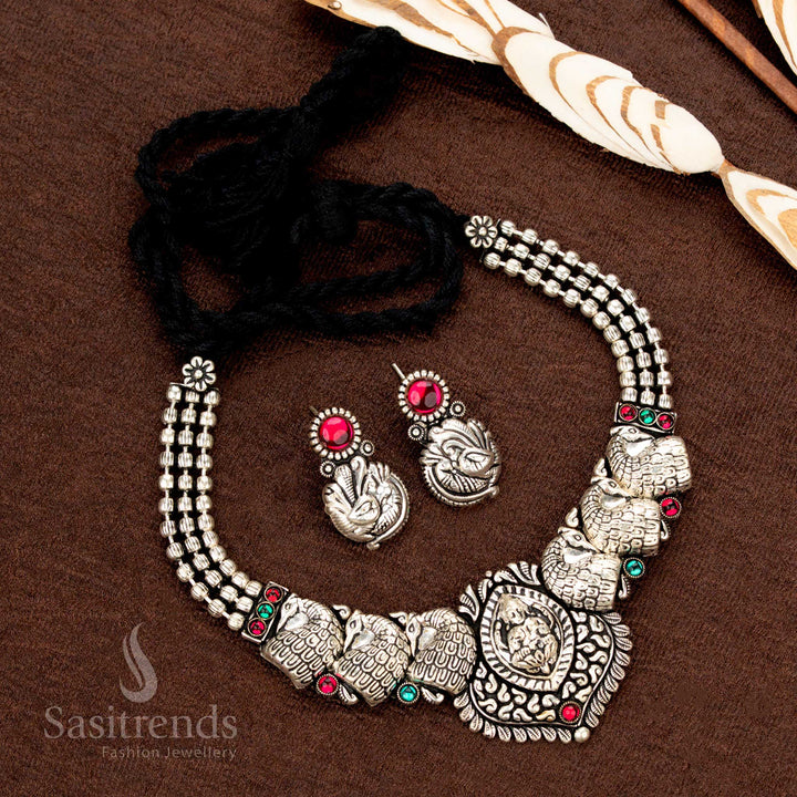Oxidised Kolapuri necklace set with peacock motifs and floral centrepiece - Sasitrends 