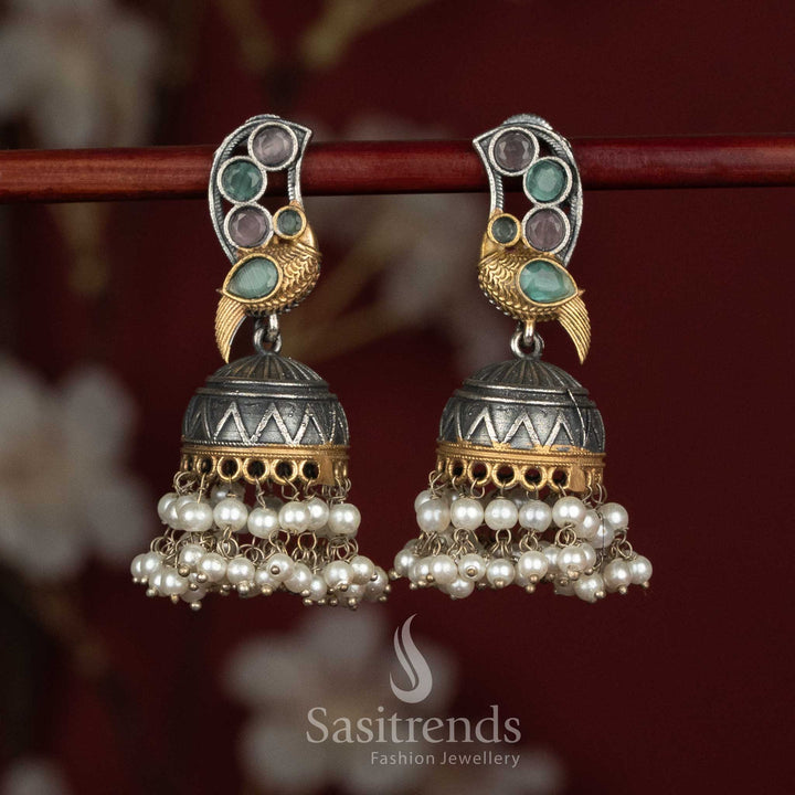 Sasitrends oxidised peacock motif jhumka earrings with Monalisa stone detailing and layered pearl hangings for party wear