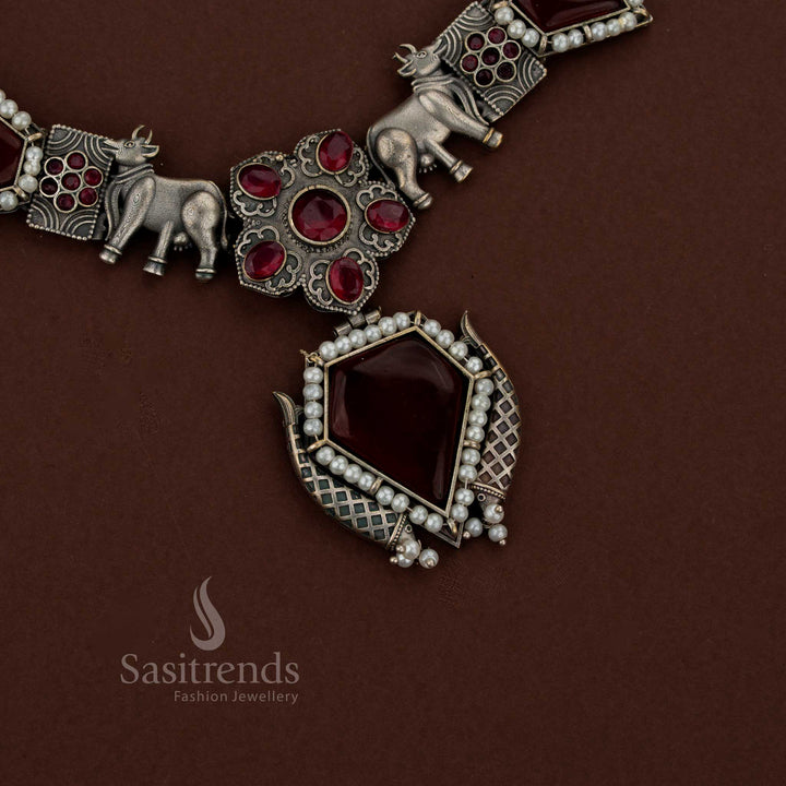 Sasitrends red oxidised husli necklace jewellery set featuring Gomatha motif, geometric pendant and matching stud earrings for festive styling