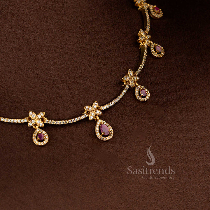 Sasitrends premium white ruby American diamond matte gold floral motif necklace with ruby teardrop stone detailing