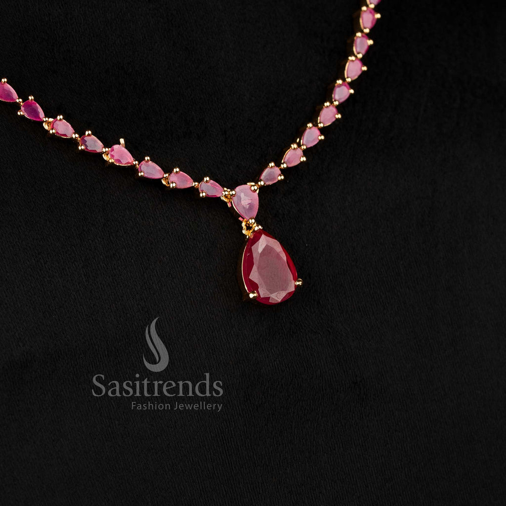 Sasitrends elegant micro gold plated ruby American diamond stone studded necklace set with structured teardrop design and matching drop earrings 