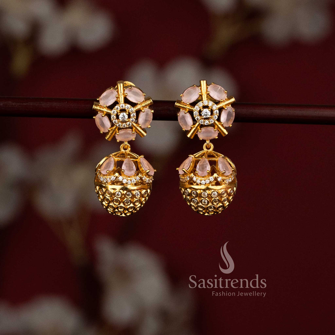 Sasitrends pink American Diamond matte gold plated earrings featuring floral wheel stud design with dome shaped jhumka drop