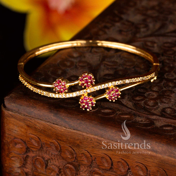 Sasitrends premium micro gold plated four floral-shaped crystal clusters white ruby American diamond openable kada bracelet crafted with sparkling stones and rich gold tone polish offering a guaranteed elegant statement look.