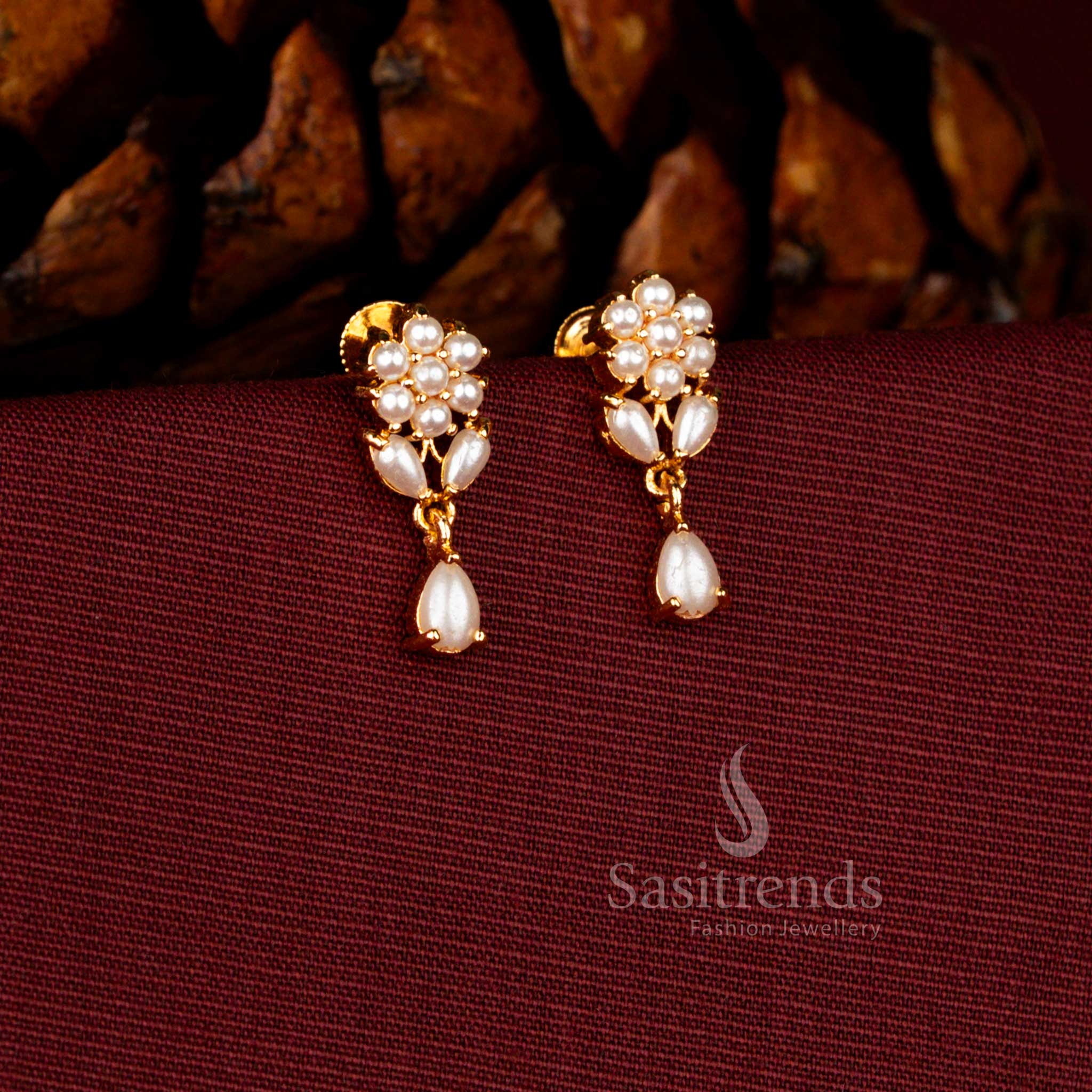 Sasitrends premium micro gold plated pearl cluster dangler earrings adorned with a brilliant teardrop AD stone stud and rich polished finish perfect for bridal and grand celebration wear.