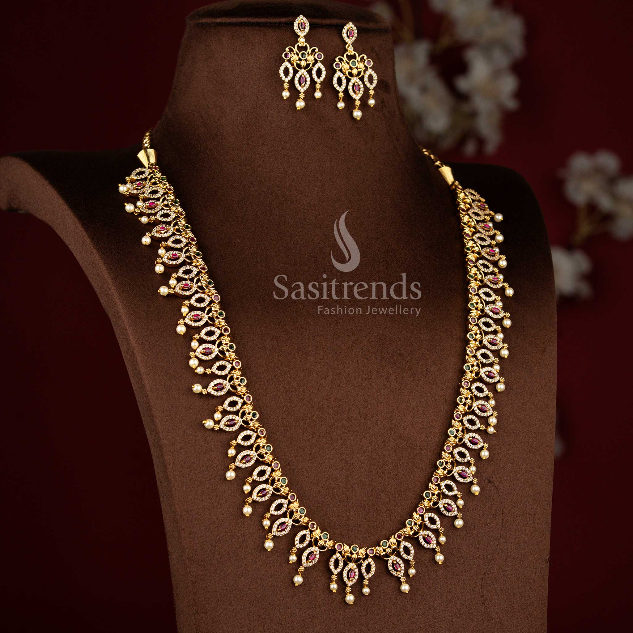 Sasitrends premium temple matte gold plated paisley vine pearl drop multi AD stone long necklace jewellery set crafted with intricate traditional detailing for weddings, engagement ceremonies, festive occasions, poojas and cultural celebrations