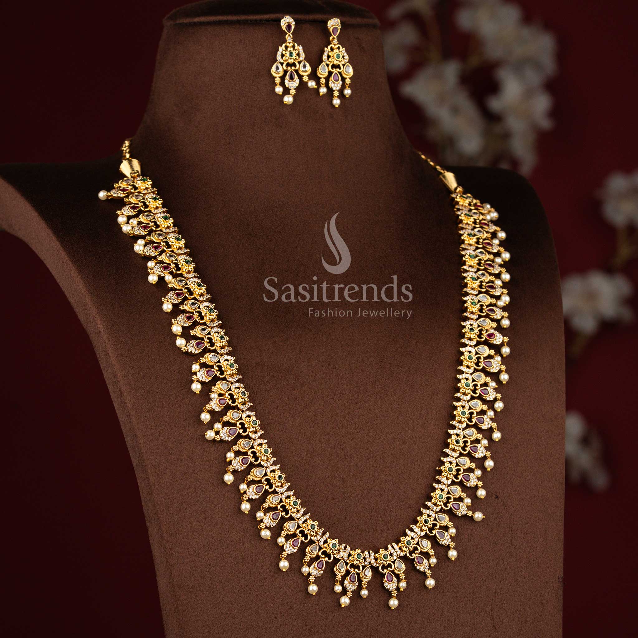 Sasitrends premium temple matte gold plated teardrop motif floral multi AD stone long necklace jewellery set designed for weddings, receptions, festive celebrations, cultural events and traditional family functions