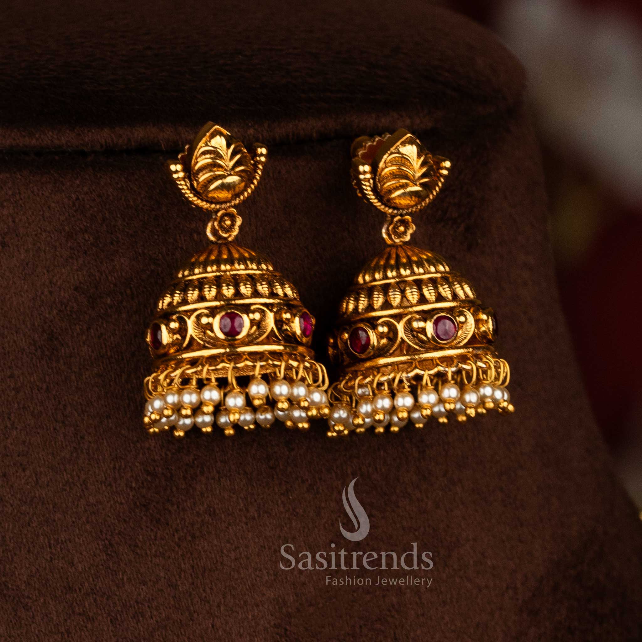 Sasitrends premium temple wear necklace jewellery set crafted with detailed floral leaf motifs, ruby AD stones, and a high-quality matte gold plated finish