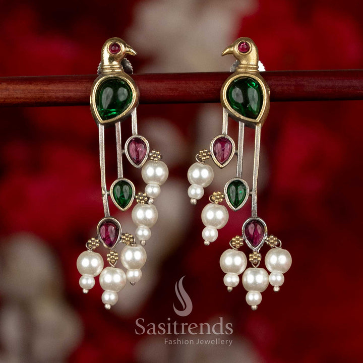 
Sasitrends oxidised silver parrot motif earrings in red and green colour combination featuring balanced long drop design with pearl detailing
