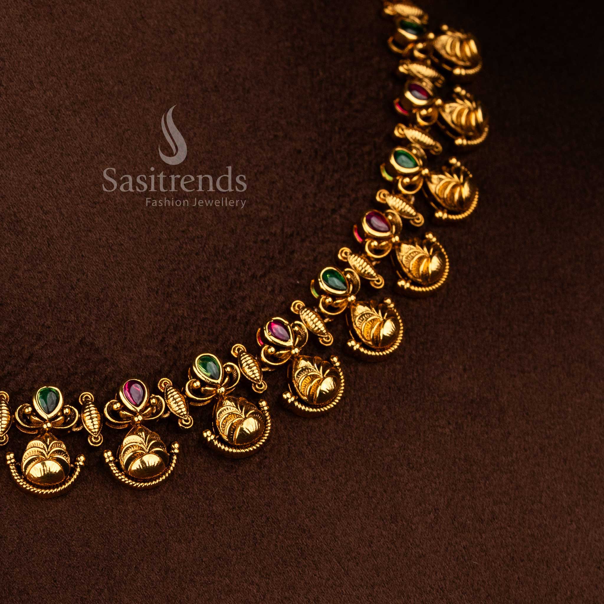 Sasitrends festive and wedding temple necklace set designed with elegant floral leaf patterns, ruby green AD stone highlights, and a rich traditional appearance