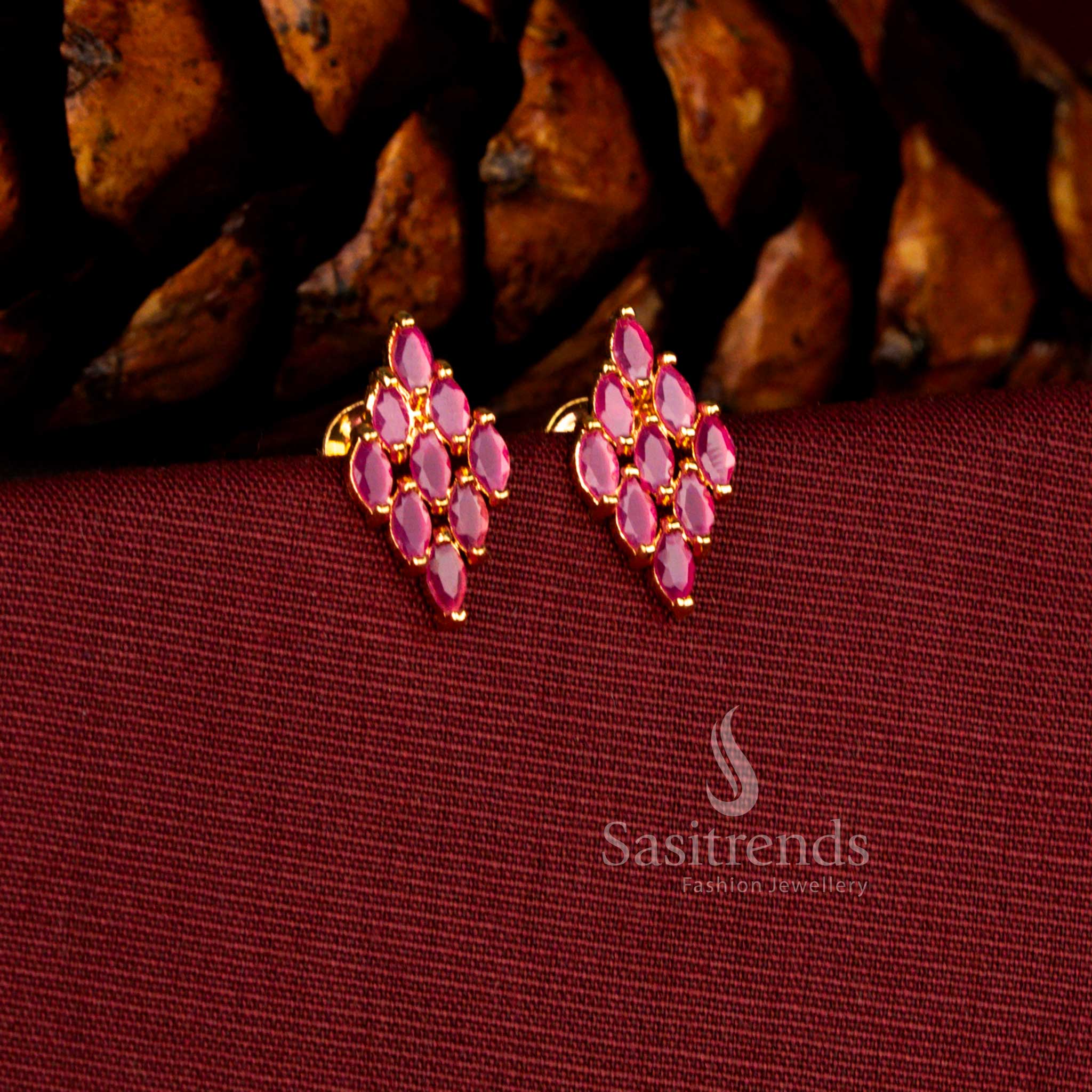 Sasitrends premium micro gold plated rhombus drop earrings designed with brilliant ruby AD stones and a rich 24K gold lustre appearance that offers a real gold look for special occasions.