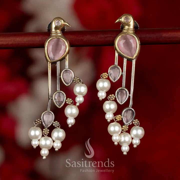 Sasitrends oxidised silver parrot motif earrings in pink shade highlighting elegant elongated structure and pearl hangings for ethnic occasions
