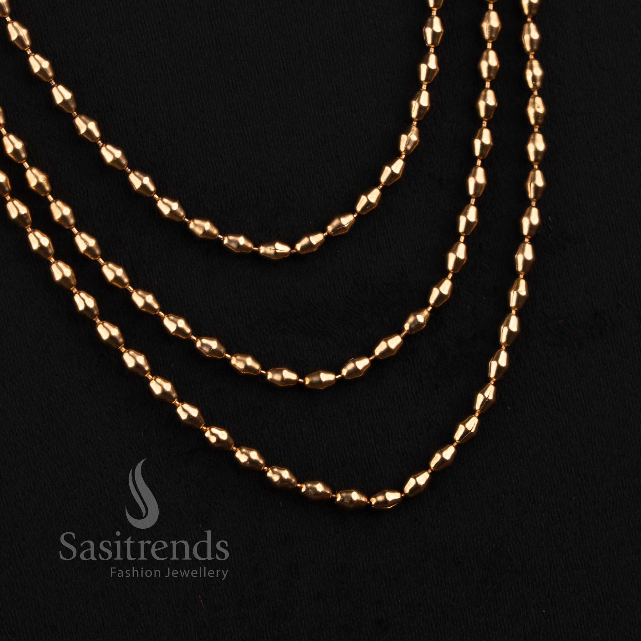 Sasitrends South Indian antique gold double and triple layer rice bead long haram necklace set with sunburst hanging ball earrings