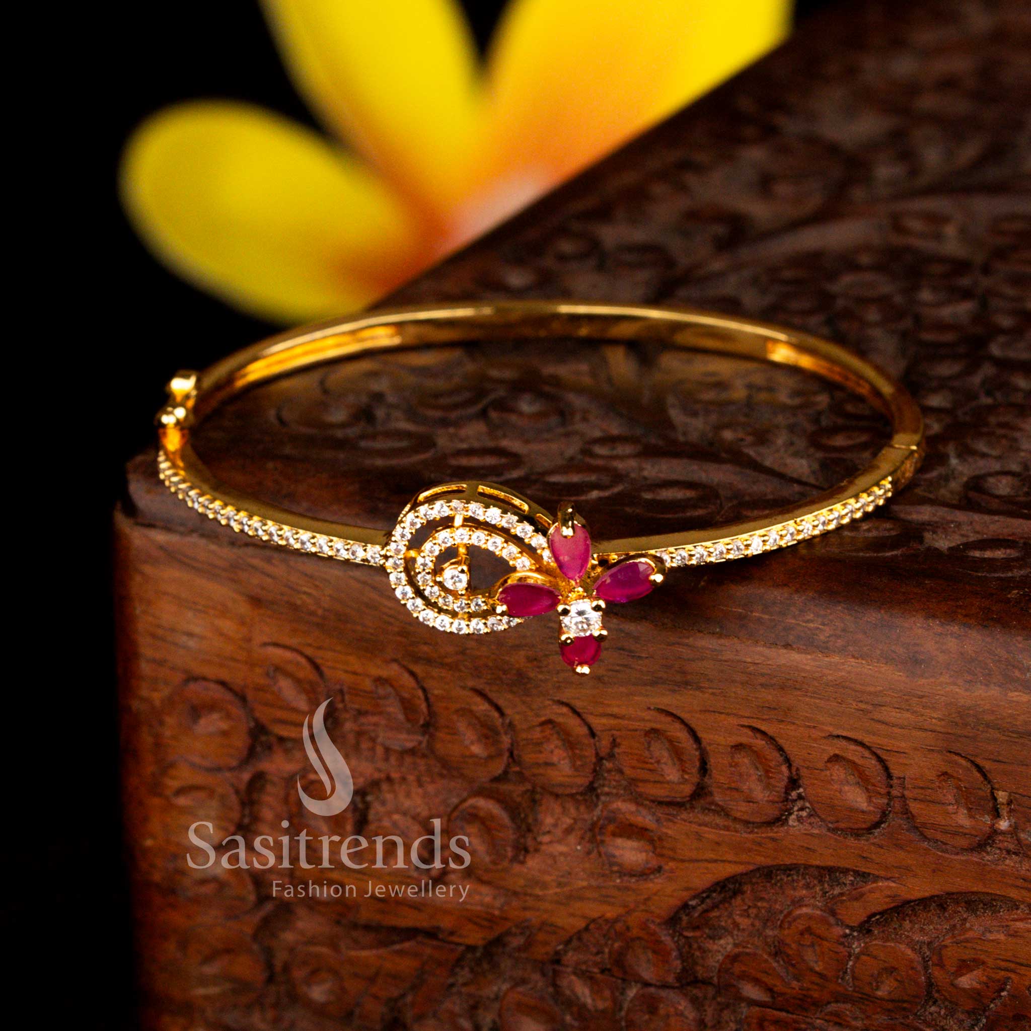 Sasitrends statement micro gold plated swirl motif floral accent white ruby American diamond openable kada bracelet featuring bold styling and guaranteed gold finish appeal.