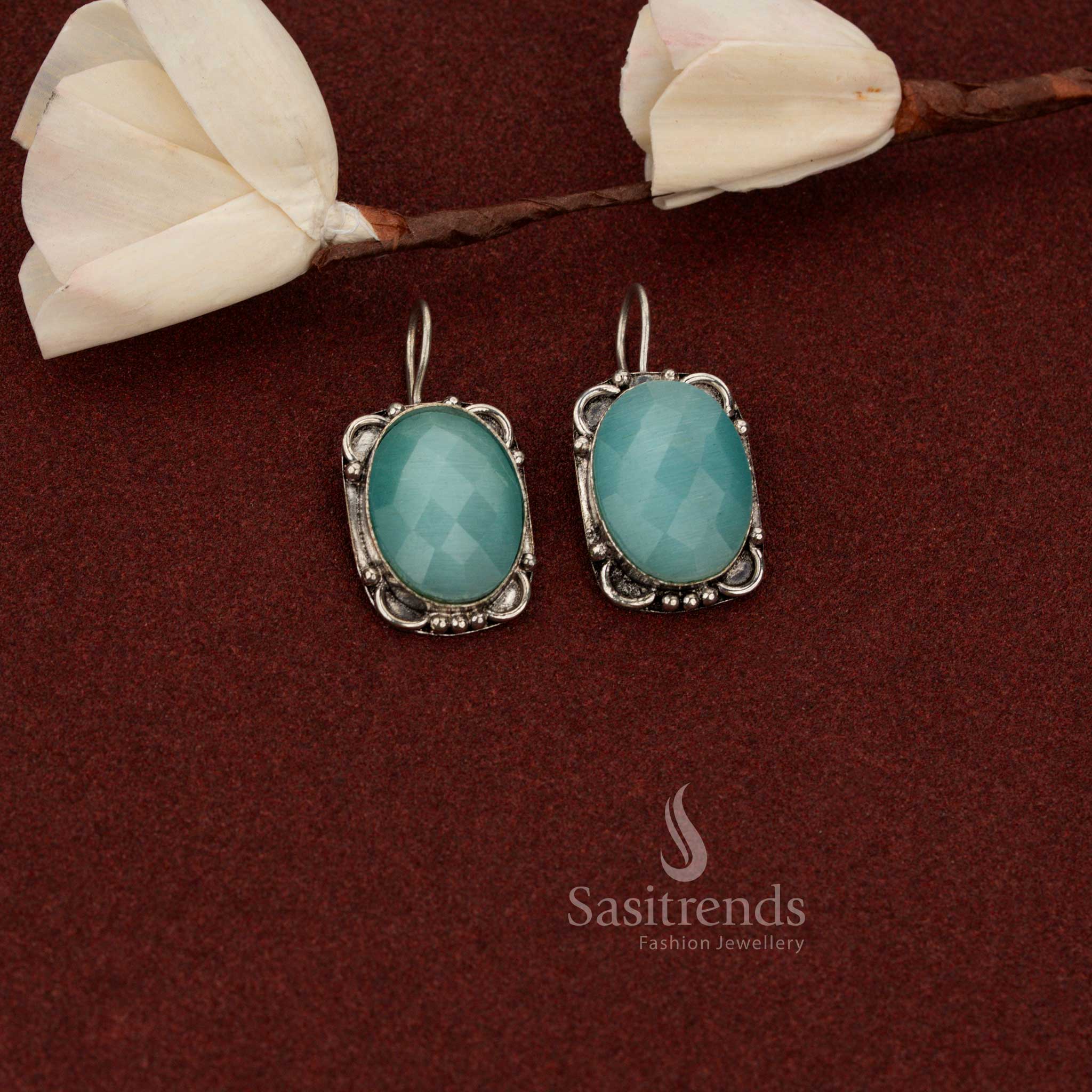 Sasitrends stunning oxidised German silver drop earrings featuring oval faceted ocean blue stone set inside a vintage floral frame design