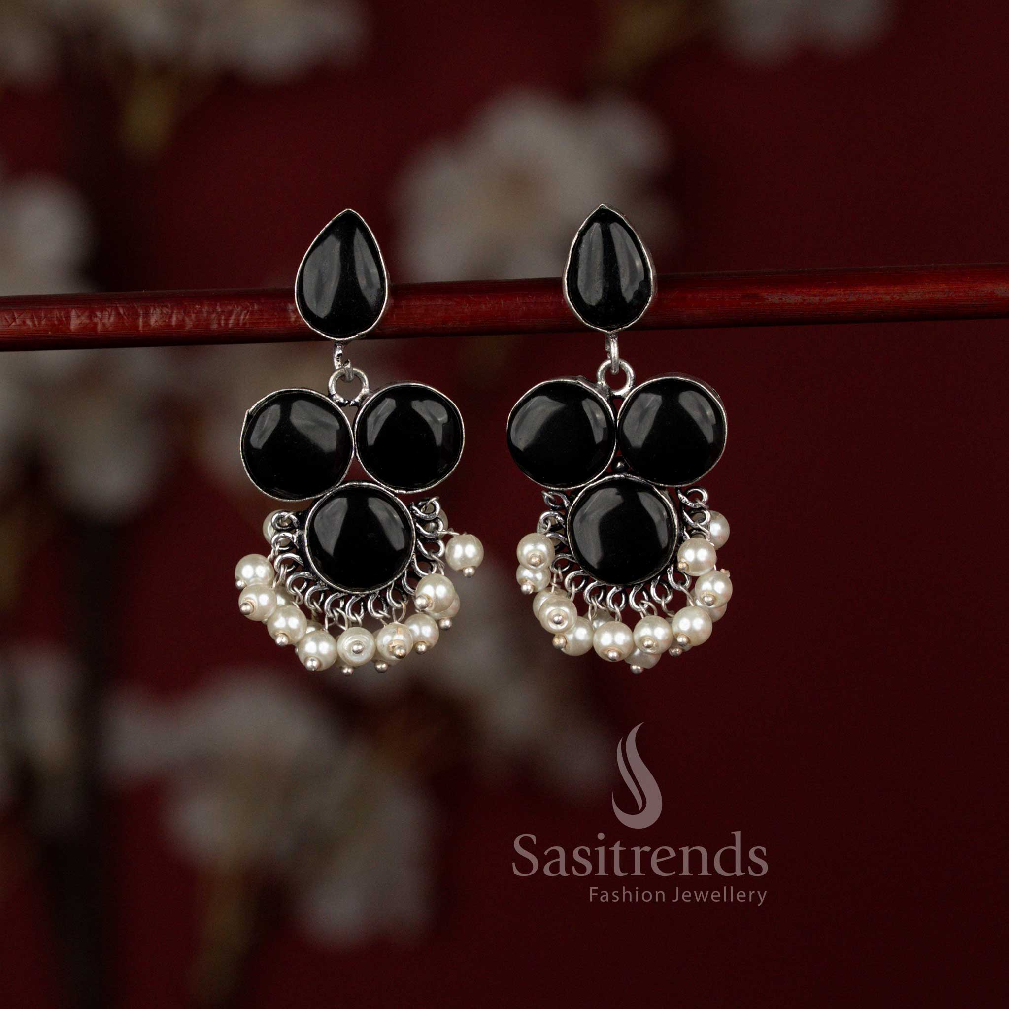 Stylish black oxidised silver Monalisa stone earrings from Sasitrends featuring a balanced round and teardrop design enhanced with pearl accents, offering a polished look for office meetings and smart casual outfits.