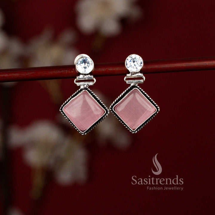 Stylish pink oxidised drop earrings by Sasitrends showcasing a geometric rhombus silhouette highlighted with a luminous Monalisa stone, suitable for daily office wear, light festive dressing and casual gatherings.