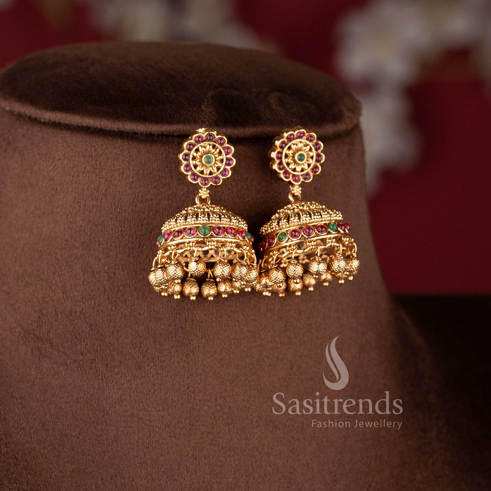 Grand bridal temple matte gold Nakshi style choker necklace featuring Lakshmi and peacock design with ruby and green stone combination for traditional bridal wear