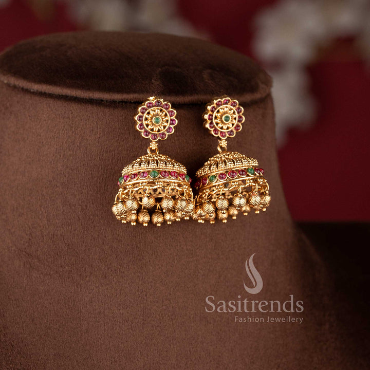 Grand bridal temple matte gold Nakshi style choker necklace featuring Lakshmi and peacock design with ruby and green stone combination for traditional bridal wear