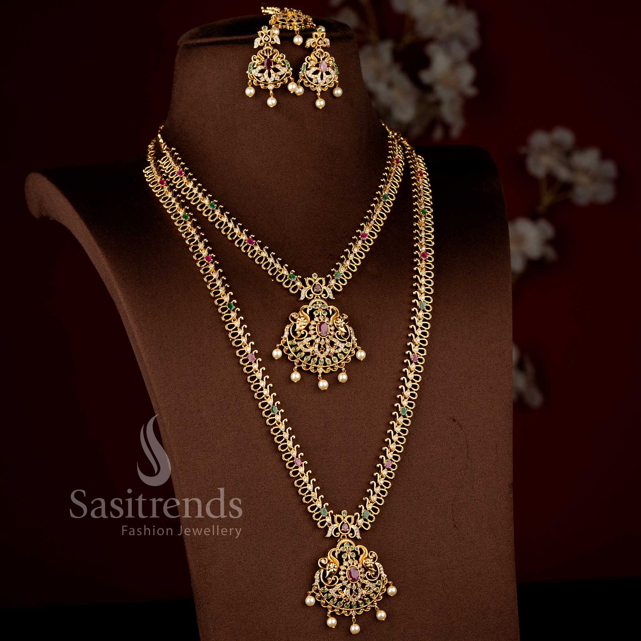 Sasitrends temple matte gold plated multi AD stone short and long layered necklace jewellery set with circular peacock and floral pendant motifs 