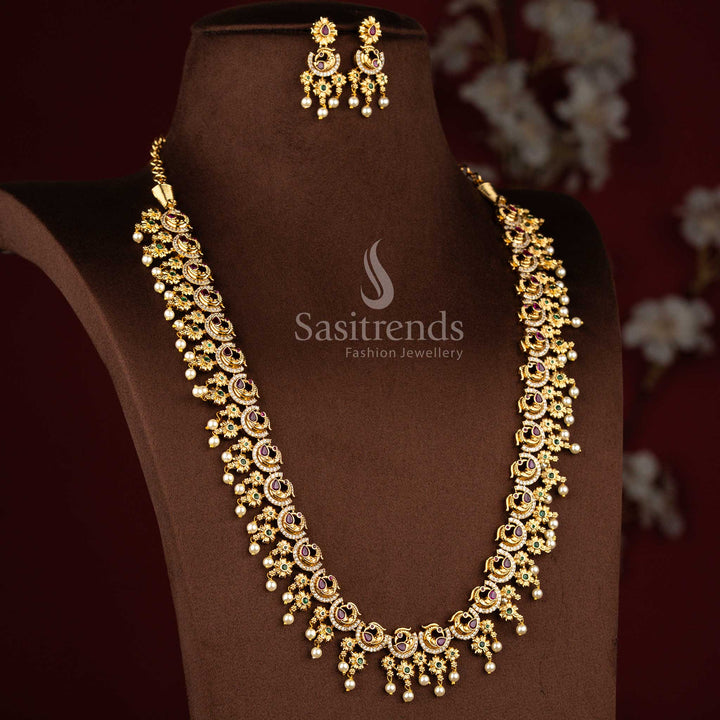 Sasitrends temple matte gold plated peacock floral multi AD stone long necklace jewellery set designed with intricate traditional detailing for bridal, wedding and grand festive occasions
