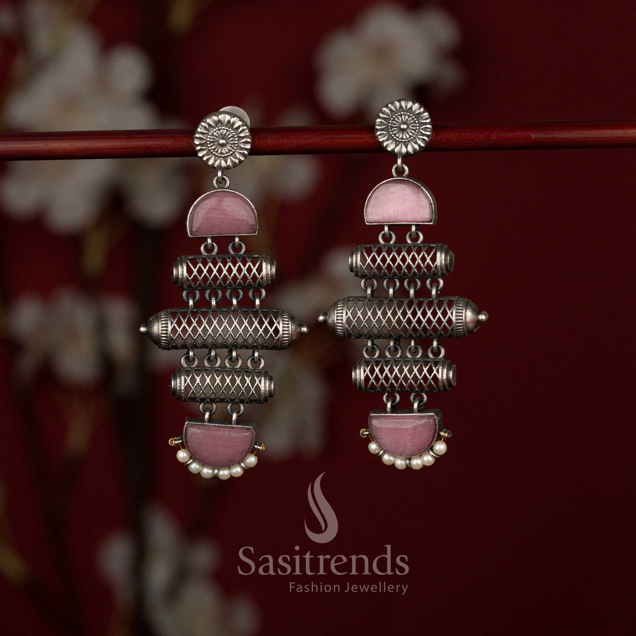 Textured cylindrical oxidised silver plated earrings from Sasitrends designed with stacked barrel layers, decorative pink stone panel accents and delicate pearl drops that enhance traditional and fusion outfits.