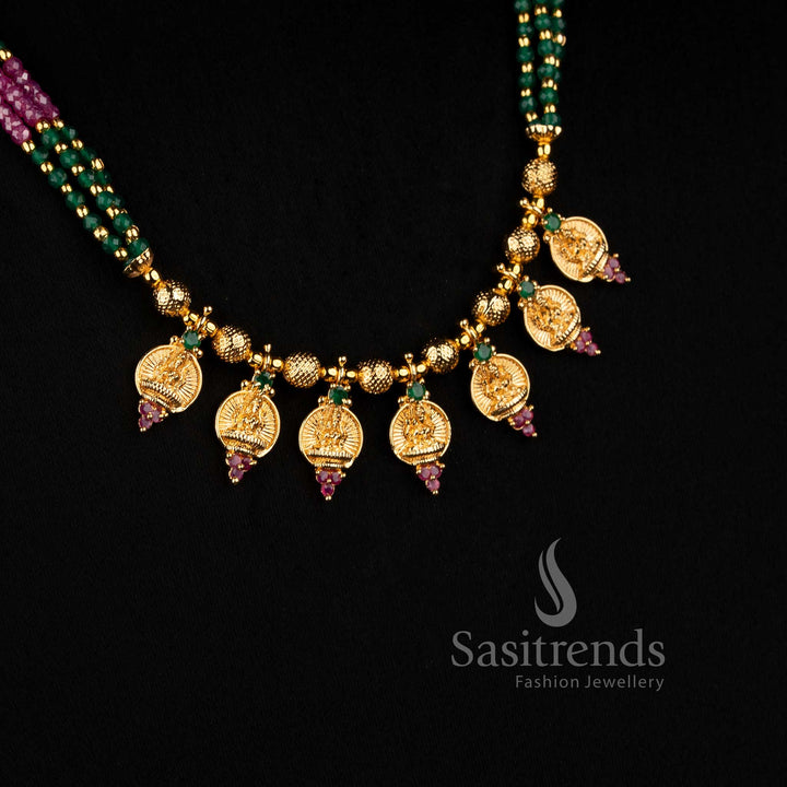 Detailed beaded Lakshmi necklace with seven individually suspended Goddess Lakshmi pendants, textured gold-tone connectors and American Diamond beadwork for festive traditional wear