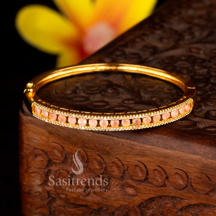 Sasitrends traditional micro gold plated two rows of petite white peach American diamond openable kada bracelet ideal for wedding styling with refined gold tone finish.
