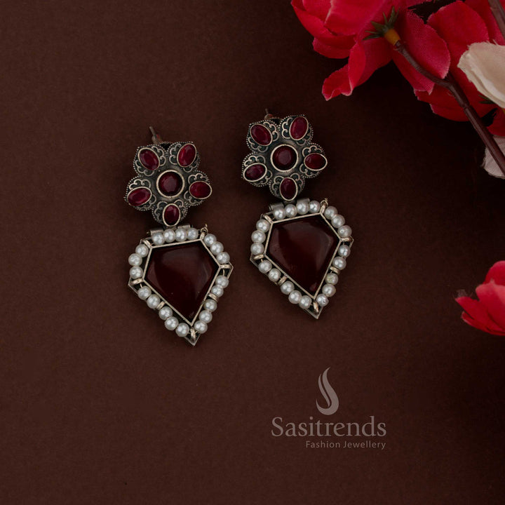 Sasitrends traditional red oxidised husli necklace set highlighting Gomatha motif and structured geometric centerpiece with stud earrings