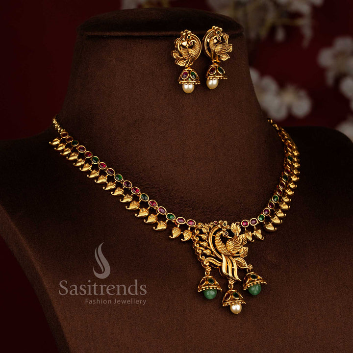 Sasitrends South Indian temple style matte gold plated ruby green Ad stone leaf motif necklace set with peacock pendant for saree wear