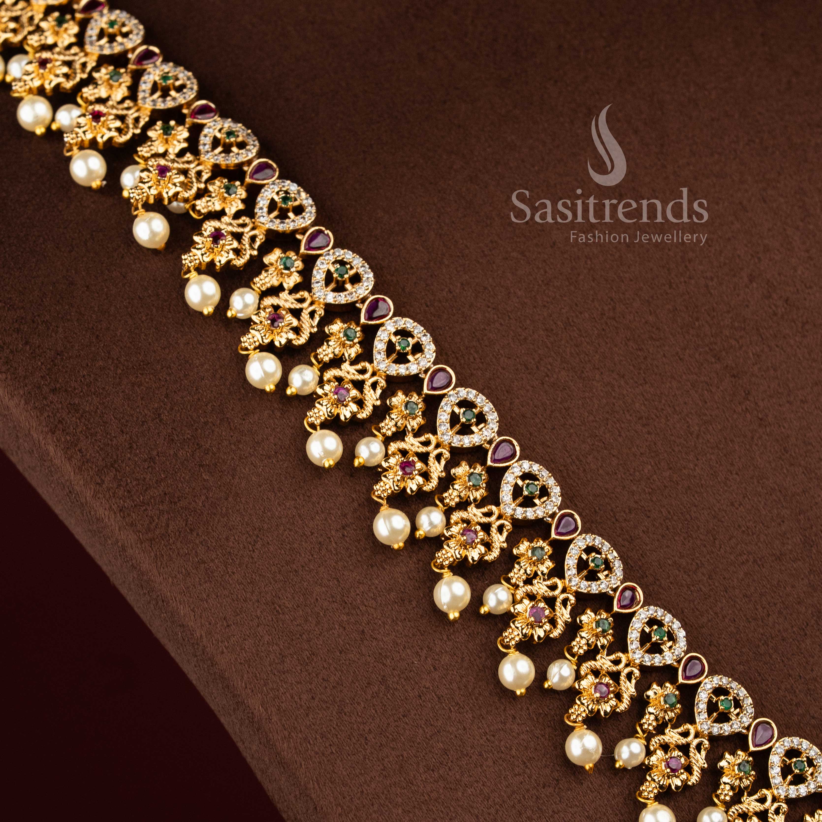 Sasitrends traditional temple matte gold plated peacock teardrop floral motif pearl drop multi AD stone long necklace jewellery set inspired by heritage craftsmanship suitable for bridal wear, religious ceremonies and grand family functions