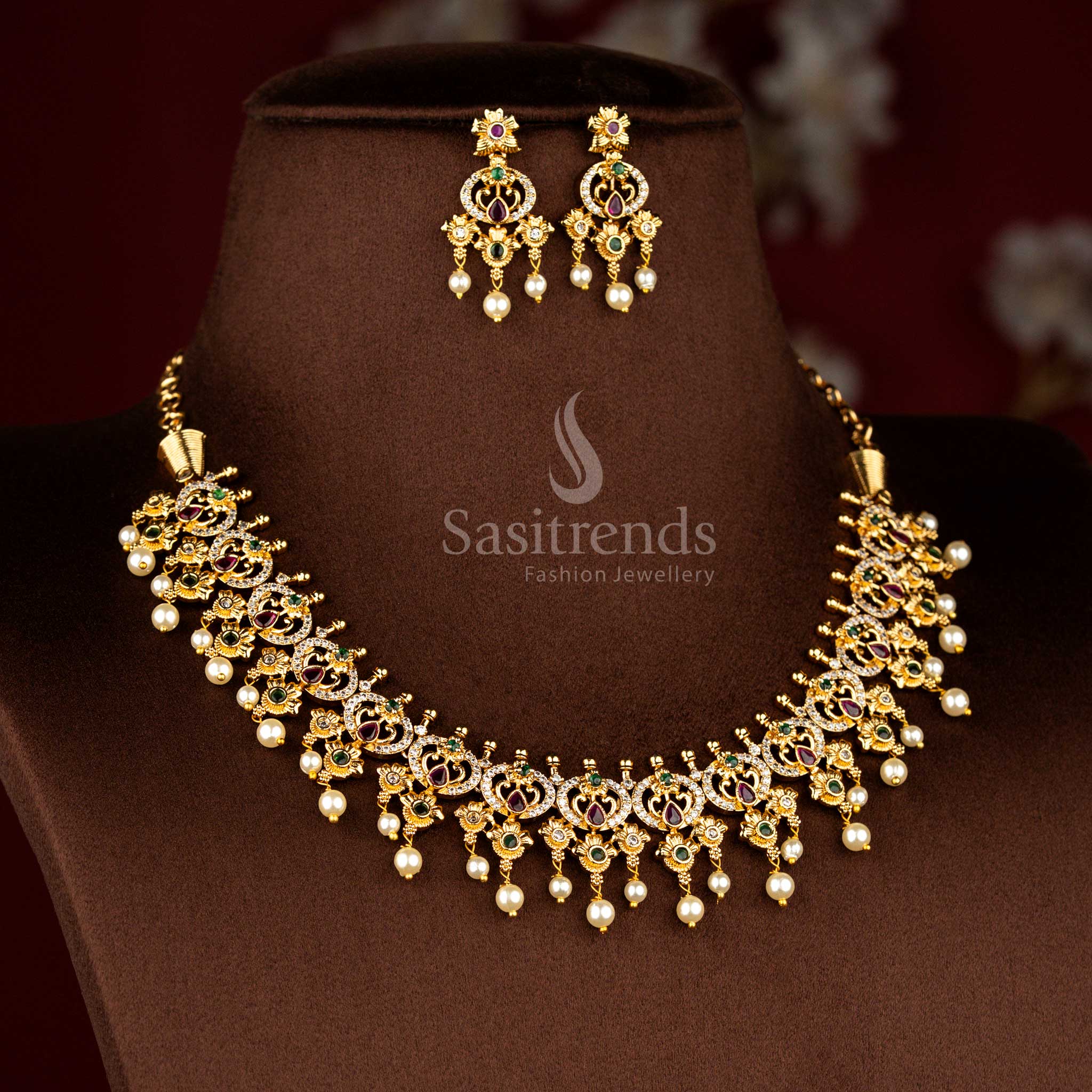 Sasitrends traditional temple matte gold plated peacock teardrop floral motif pearl drop multi AD stone short necklace jewellery set inspired by heritage artistry suitable for bridal styling, religious functions and grand family ceremonies