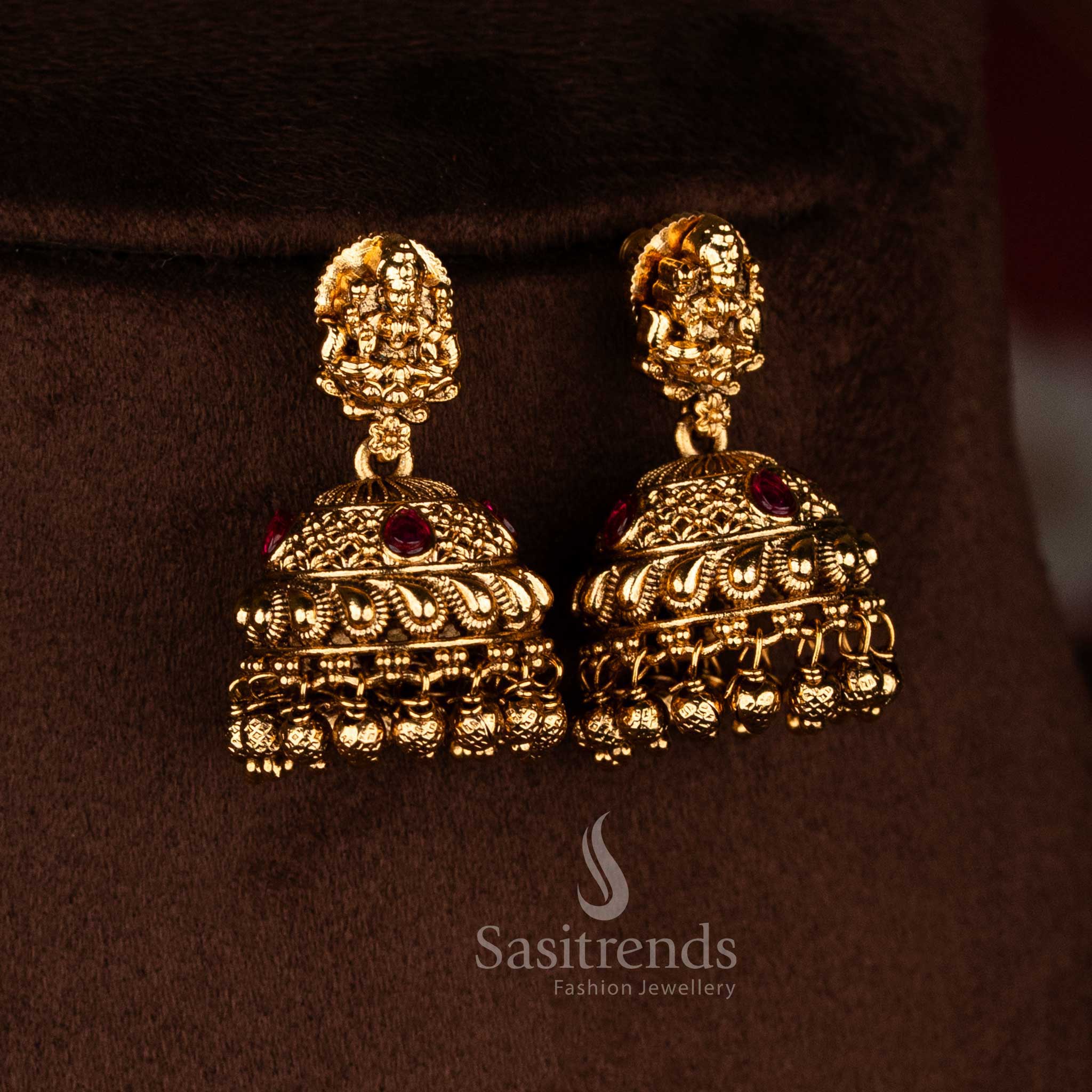 Temple matte gold plated ruby AD stone Goddess Lakshmi motif jhumka earrings featuring detailed dome design and multiple hanging bead drops, premium traditional temple jewellery - Sasitrends