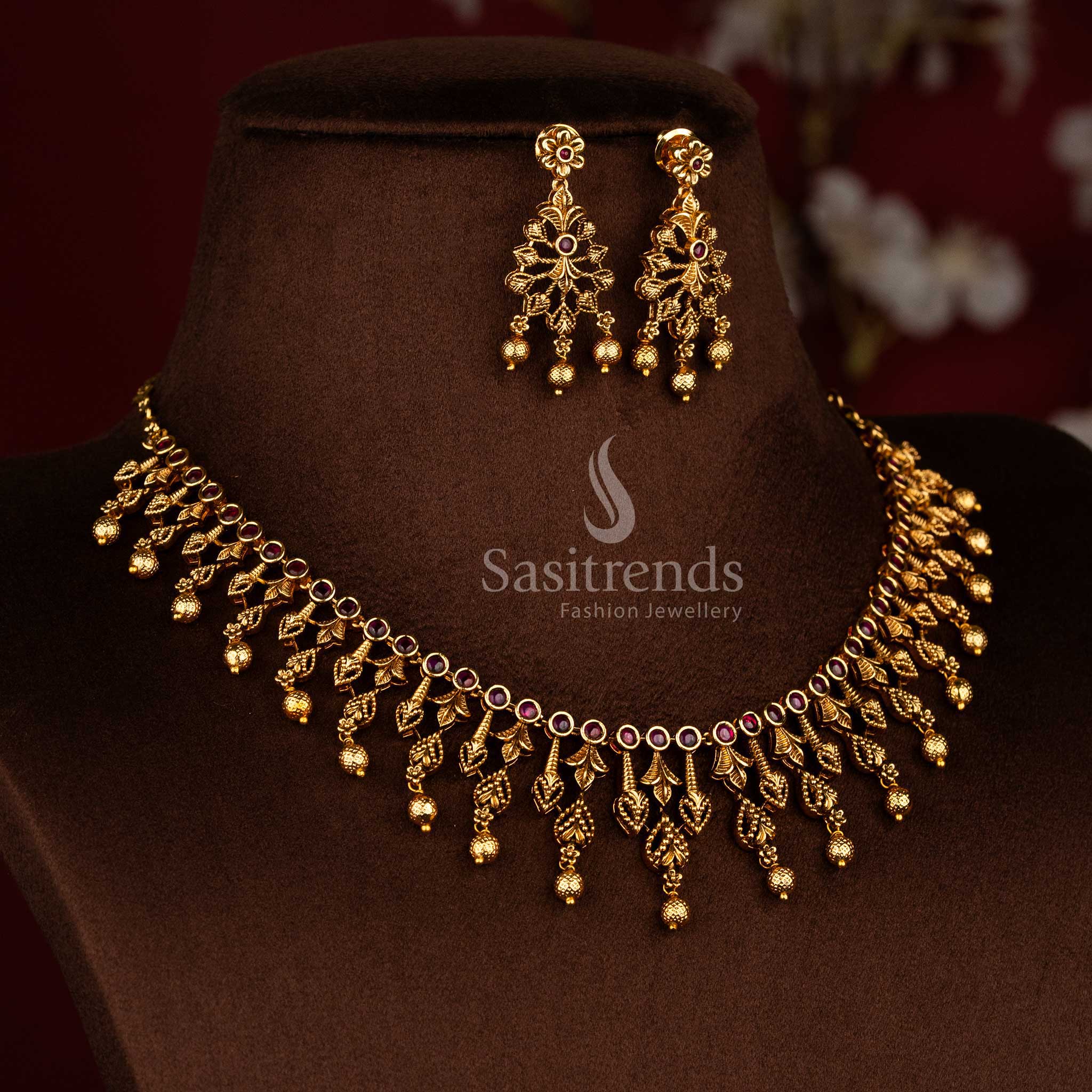 Traditional temple style matte gold ruby AD stone necklace set with carved leaf design and rich bead detailing, high quality jewellery suitable for saree wear and sasree functions - Sasitrends