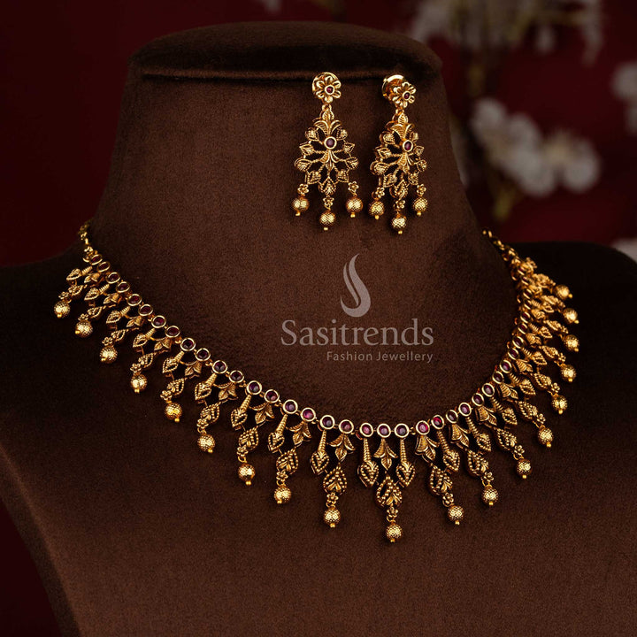 Traditional temple style matte gold ruby AD stone necklace set with carved leaf design and rich bead detailing, high quality jewellery suitable for saree wear and sasree functions - Sasitrends