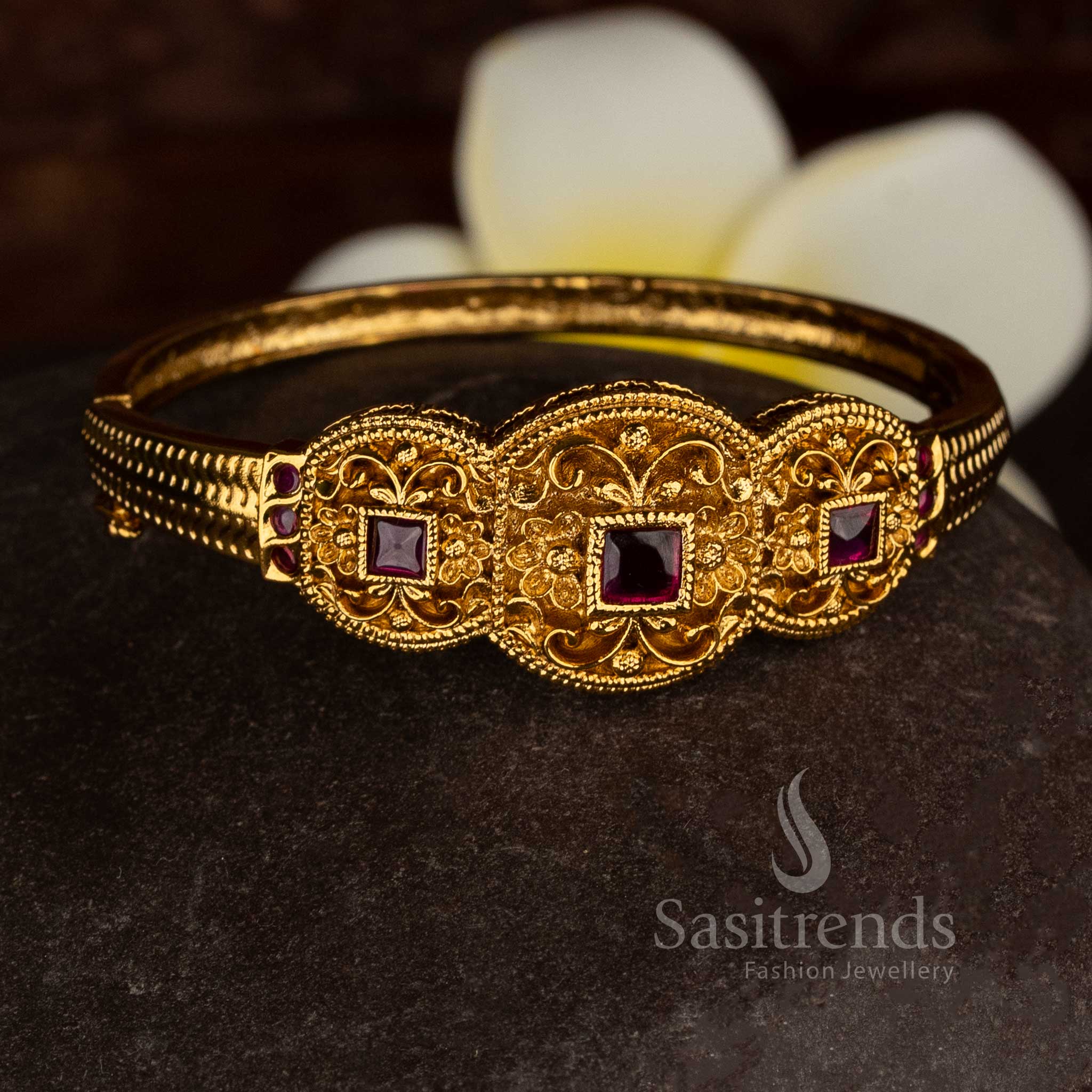 Traditional temple style openable kada bracelet with matte gold finish and ruby AD stone medallion detailing, high quality jewellery suitable for saree wear, sasree and weddings - Sasitrends