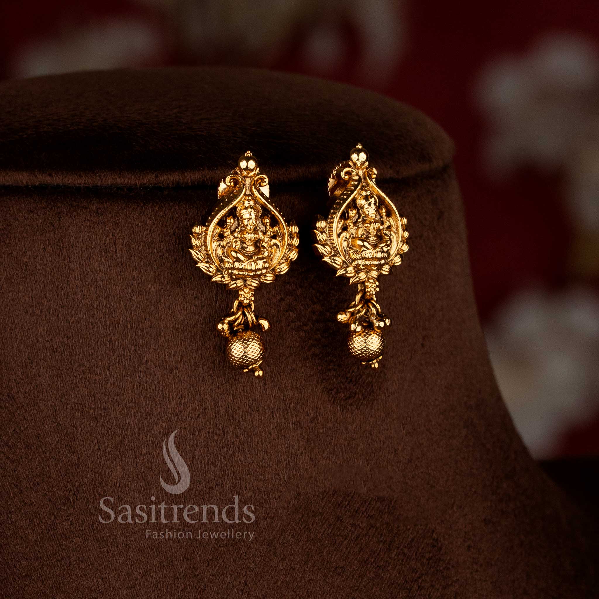 Sasitrends temple matte gold plated Lakshmi Devi motif drop earrings with rich premium traditional look